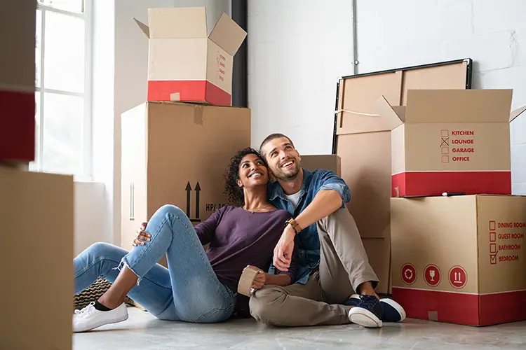 Young couple surrounded by boxes