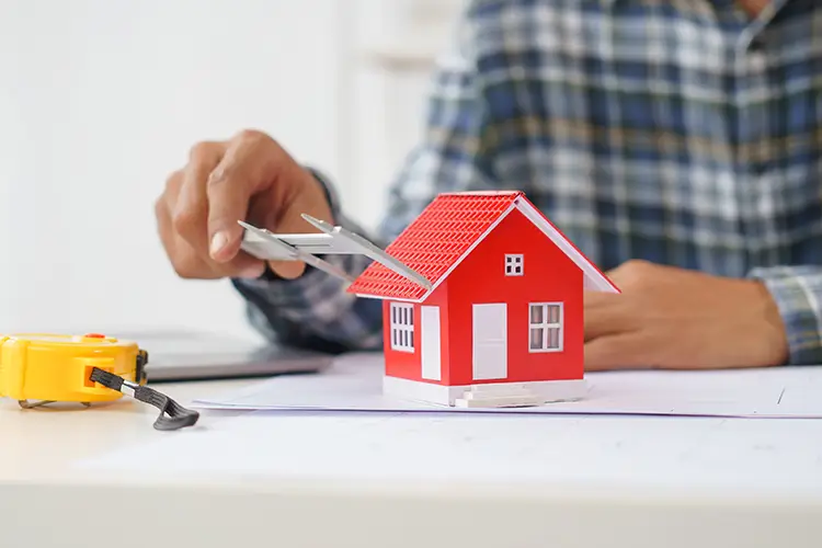 Person measuring model red house