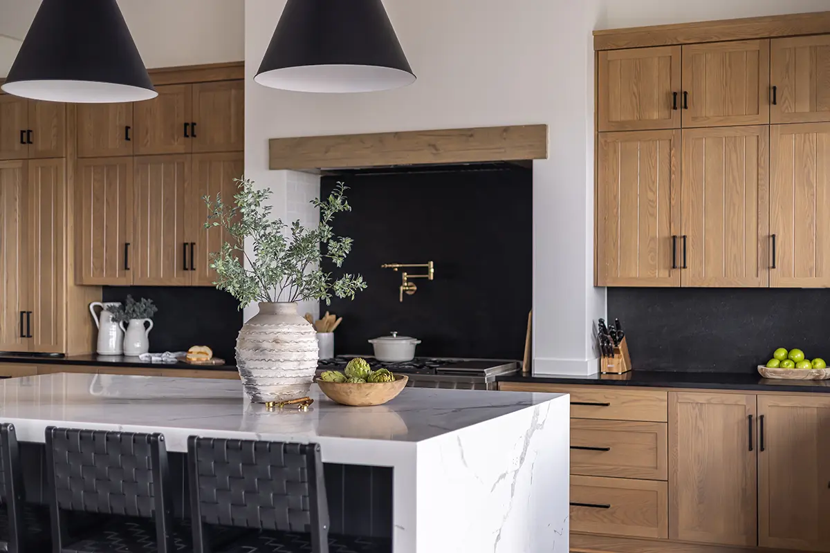 Modern kitchen interior with wooden cabinets and accents.